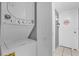 Stacked washer and dryer in a dedicated laundry area with a white door at 8217 Sun Spring Cir # 41, Orlando, FL 32825