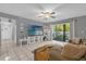 The open living room features tiled floors, a ceiling fan, and a sliding glass door at 8217 Sun Spring Cir # 41, Orlando, FL 32825