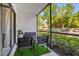 Screened-in patio with outdoor furniture and views of lush landscaping at 8217 Sun Spring Cir # 41, Orlando, FL 32825