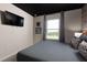 Relaxing bedroom with a gray color palette, a large window, and Star Wars themed decor at 977 Paradise Dr, Davenport, FL 33897