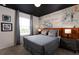 Themed bedroom featuring a unique Star Wars mural, black ceiling, and contemporary furnishings at 977 Paradise Dr, Davenport, FL 33897