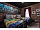 The bedroom has two twin beds with a Harry Potter themed decor and brick accent walls at 977 Paradise Dr, Davenport, FL 33897