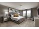 Comfortable bedroom featuring neutral tones, plush carpet, and ample natural light from large windows at 977 Paradise Dr, Davenport, FL 33897