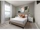 Well-lit bedroom with carpeted floors, neutral walls, and stylish bedside tables at 977 Paradise Dr, Davenport, FL 33897