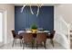Elegant dining area with stylish table, chairs, and a statement lighting fixture at 977 Paradise Dr, Davenport, FL 33897