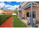 Charming patio area with manicured lawn and lush landscaping, perfect for outdoor living at 979 Park Terrace Cir, Kissimmee, FL 34746
