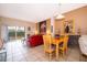 Open concept living area with dining space, tile floors, and sliding glass doors to a patio at 979 Park Terrace Cir, Kissimmee, FL 34746