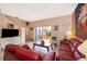 Cozy living room featuring a sliding glass door to a private backyard at 979 Park Terrace Cir, Kissimmee, FL 34746