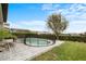 Inviting backyard pool with a -safety fence and ample patio space for relaxation at 9870 Summerlake Groves St, Winter Garden, FL 34787