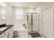 Light and airy bathroom with shower, soaking tub, granite vanity, and tile flooring at 9870 Summerlake Groves St, Winter Garden, FL 34787