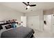 Cozy bedroom featuring neutral colors, plush carpeting, and a double-door closet for ample storage at 9870 Summerlake Groves St, Winter Garden, FL 34787