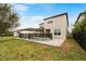 Backyard featuring a modern pool with a safety fence and well-maintained lawn at 9870 Summerlake Groves St, Winter Garden, FL 34787