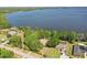 Expansive aerial view of the lake, highlighting the home's waterfront location and serene surroundings at 9900 W Lake Marion Rd, Haines City, FL 33844