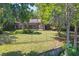 Expansive fenced backyard featuring a screened lanai, offering privacy and outdoor enjoyment at 9900 W Lake Marion Rd, Haines City, FL 33844