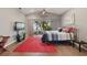 This primary bedroom features a fan, and sliding glass doors leading to the outside at 9900 W Lake Marion Rd, Haines City, FL 33844