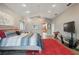 Large bedroom with vaulted ceiling, ceiling fan, and views into the ensuite bathroom at 9900 W Lake Marion Rd, Haines City, FL 33844