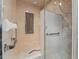 This shower features glass doors, grab bars and marbled tile at 9900 W Lake Marion Rd, Haines City, FL 33844