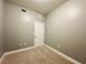 Neutral carpeted bedroom features neutral paint and a white door at 101 S Eola Dr # 1209, Orlando, FL 32801