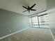 Bedroom featuring neutral walls, carpet and a view of city buildings from a large window at 101 S Eola Dr # 1209, Orlando, FL 32801