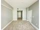 Neutral bedroom featuring neutral-colored walls, carpet and white trim and doors at 101 S Eola Dr # 1209, Orlando, FL 32801