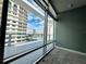 Bedroom view featuring a large window with outside views at 101 S Eola Dr # 1209, Orlando, FL 32801
