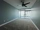 Bedroom features neutral colored walls, carpet flooring, and large window with outside views at 101 S Eola Dr # 1209, Orlando, FL 32801