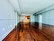 Open floor plan with hardwood floors and a glimpse into the kitchen at 101 S Eola Dr # 1209, Orlando, FL 32801