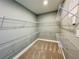 Gray walk-in closet featuring white wire shelves at 101 S Eola Dr # 1209, Orlando, FL 32801