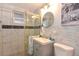 Bathroom featuring glass enclosed shower, sink, toilet, and nautical themed decorations at 103 Mason Park Dr, Daytona Beach, FL 32117