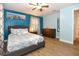Comfortable bedroom featuring a full bed, wood-look flooring, dresser, and plenty of natural light at 103 Mason Park Dr, Daytona Beach, FL 32117