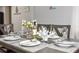 Dining room table set for dinner featuring seating for six at 103 Mason Park Dr, Daytona Beach, FL 32117