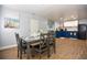 Dining area with table set and flows into the kitchen, showcasing a cozy and convenient design at 103 Mason Park Dr, Daytona Beach, FL 32117