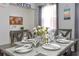 Dining room with a large table, seating for six, and natural light at 103 Mason Park Dr, Daytona Beach, FL 32117