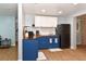 Charming kitchen with blue cabinets, butcher block countertops, subway tile, and adjacent living space at 103 Mason Park Dr, Daytona Beach, FL 32117