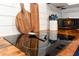 Modern kitchen featuring an electric cooktop with wooden countertop and white subway tile backsplash at 103 Mason Park Dr, Daytona Beach, FL 32117