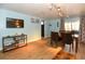 Inviting living area with hardwood floors, sliding glass doors, and a dining table at 103 Mason Park Dr, Daytona Beach, FL 32117