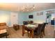 Open floor plan living area with a game table, comfortable seating, and modern lighting at 103 Mason Park Dr, Daytona Beach, FL 32117