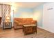 Cozy living room featuring hardwood floors, a comfortable sofa, and tasteful decor at 103 Mason Park Dr, Daytona Beach, FL 32117