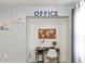 Bright office space with desk and world map adds convenience and organization at 103 Mason Park Dr, Daytona Beach, FL 32117