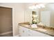 Bright bathroom with double vanity, granite countertops and a separate toilet room at 106 Oceans Cir, Daytona Beach, FL 32118