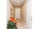 Welcoming hallway with tile flooring, decorative mirror, bench, and vibrant pillows for added style at 106 Oceans Cir, Daytona Beach, FL 32118