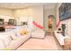 Open-concept area with modern furniture, decor, hardwood floors, and easy access to the kitchen at 106 Oceans Cir, Daytona Beach, FL 32118