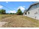 The home has a large backyard with a fence, providing privacy and space for various activities at 10900 Tangora St, Orlando, FL 32825