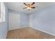 Bedroom featuring light blue walls, closet, and a ceiling fan at 10900 Tangora St, Orlando, FL 32825