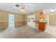 Open dining area featuring a vintage light fixture and access to bar, kitchen, and Gathering room at 10900 Tangora St, Orlando, FL 32825