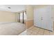 Spacious living room featuring neutral carpeting and large windows for ample natural light at 10900 Tangora St, Orlando, FL 32825