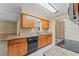Efficient kitchen featuring granite countertops and wood cabinets providing ample storage at 10900 Tangora St, Orlando, FL 32825