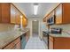 Efficient kitchen featuring granite countertops and wood cabinets providing ample storage space at 10900 Tangora St, Orlando, FL 32825