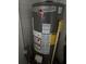 Image of a Rheem water heater with visible labels and specifications, ensuring efficient operation at 10900 Tangora St, Orlando, FL 32825