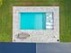 Aerial view of backyard pool with in-pool loungers, outdoor dining table and patio area at 1136 W Harvard St, Orlando, FL 32804
